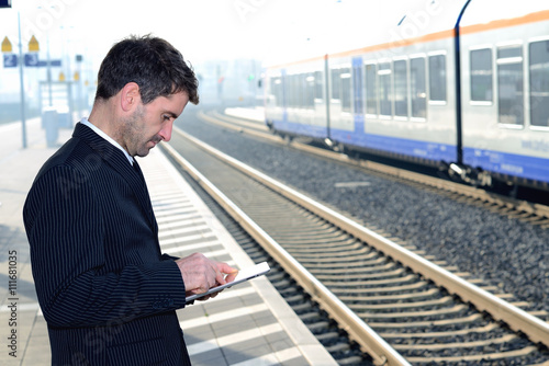 Wallpaper Mural man on business trip using tablet computer Torontodigital.ca