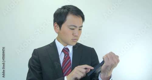 Wallpaper Mural Japanese young business man calculating costs confused face  Torontodigital.ca