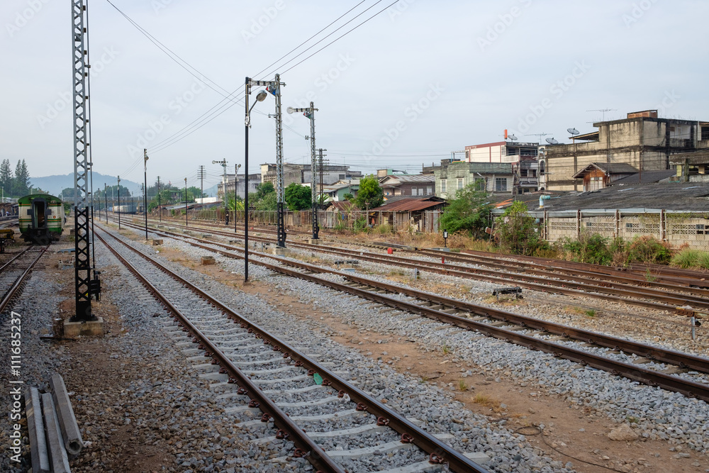 Railroad tracks line of a Public Thai Train Railway, train railway scene from passenger, go travel and journey by thailand train transportation