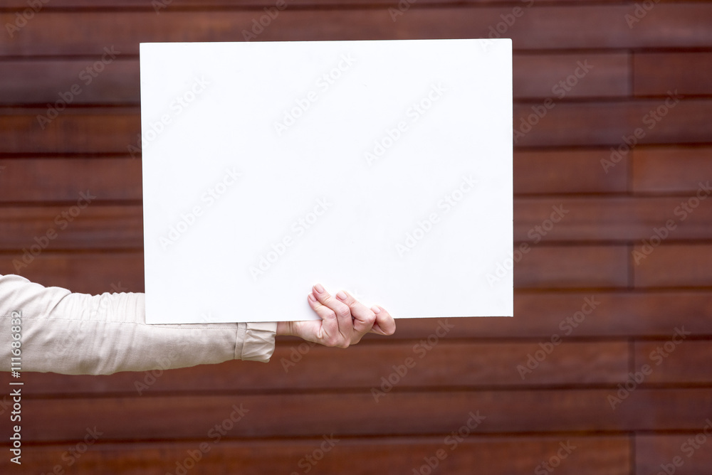 woman outside with a blank white card woman outside with a blank white card