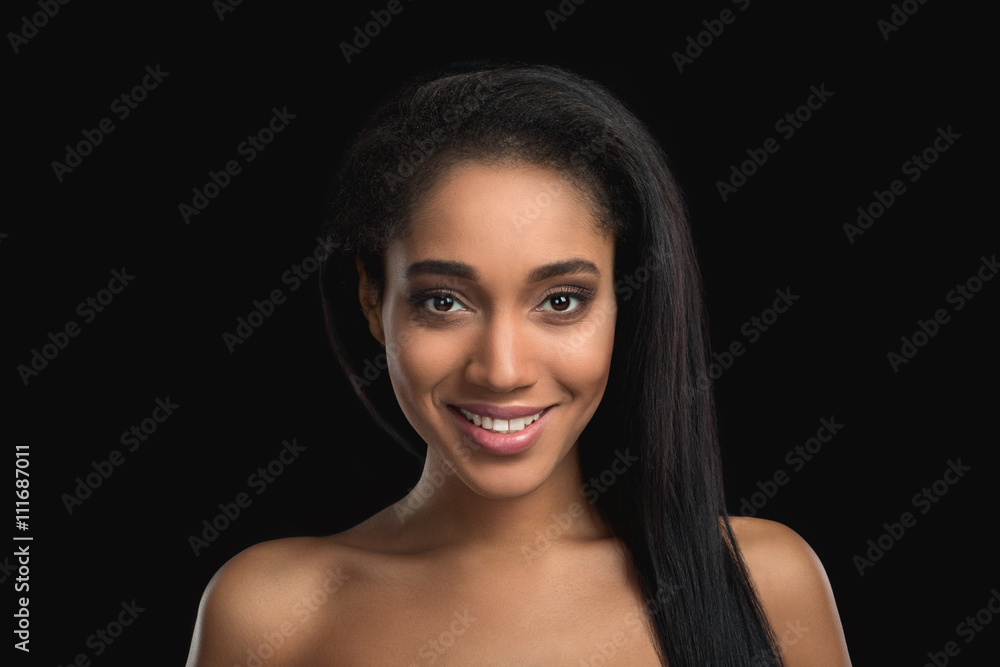 Portrait of smiling handsome nude woman on dark background. Attractive, satisfied, cheerfull african american girl Portrait of smiling handsome nude woman on dark background. Attractive, satisfied, cheerfull african american girl