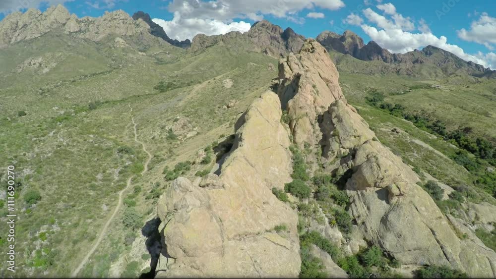 camera lowers and rotates on a small mountain range in the desert camera lowers and rotates on a small mountain range in the desert