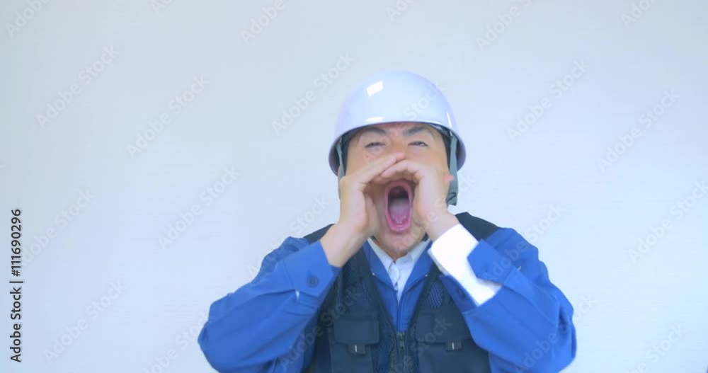 Japanese construction man looking at camera emergency red alert signal Japanese construction man looking at camera emergency red alert signal
