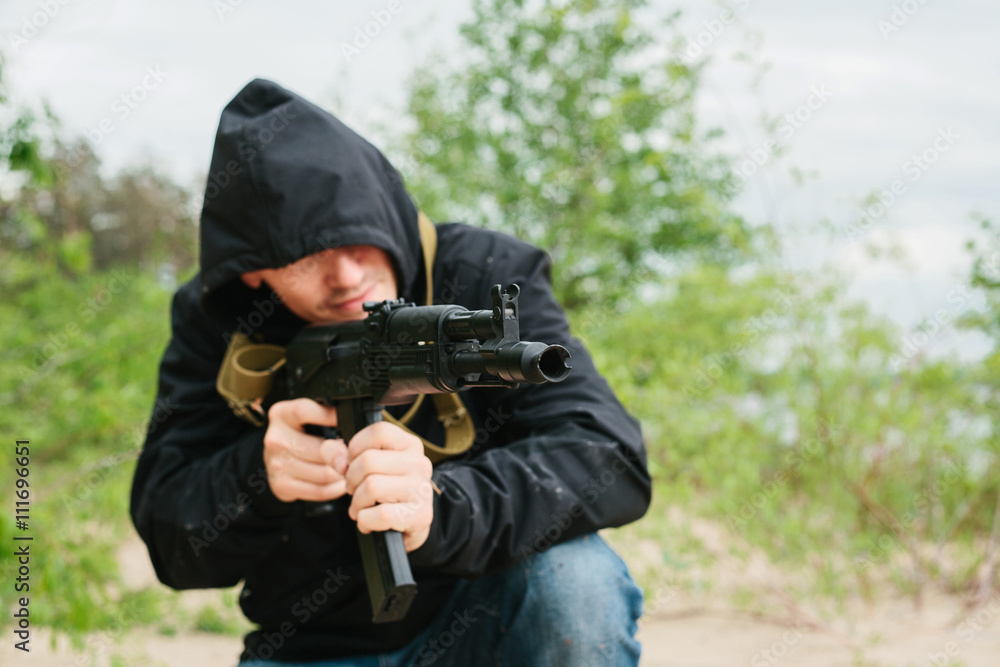 Fototapeta premium criminal with a weapon