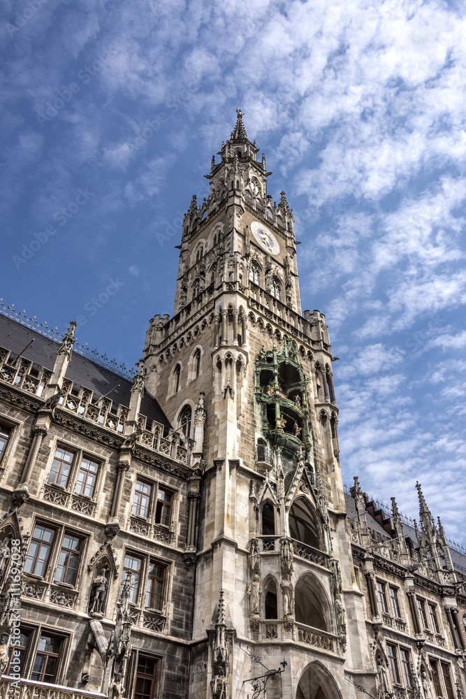 Marienplatz, Munich, Germany: Clock tower and part of the facade of the New Town Hall (Neues Rathaus) in the center of the capital of Bavaria