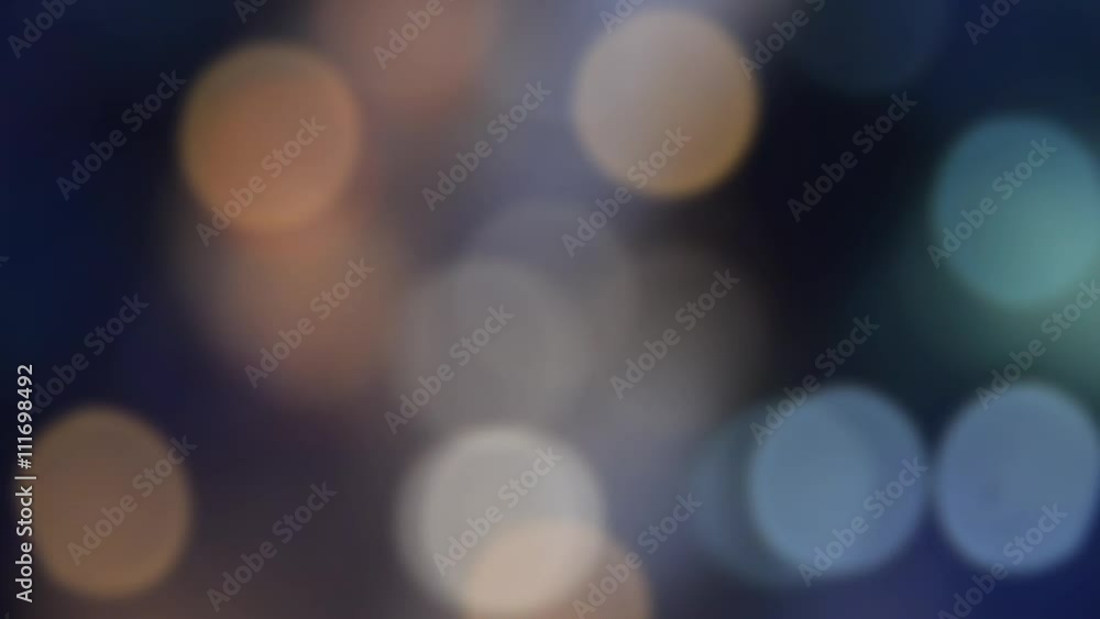 Defocused blur of city traffic on the road and xenon light at night with motion full HD Defocused blur of city traffic on the road and xenon light at night with motion full HD