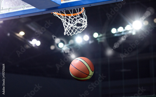 Basketball going through the hoop at a sports arena © Melinda Nagy