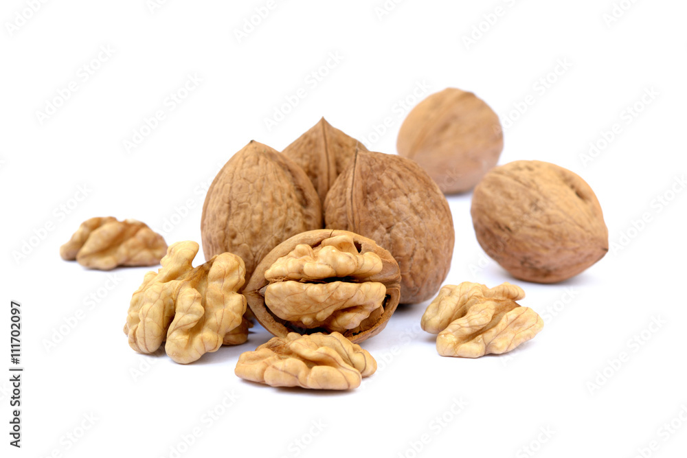 Fresh walnuts with a shell isolated on white background Fresh walnuts with a shell isolated on white background