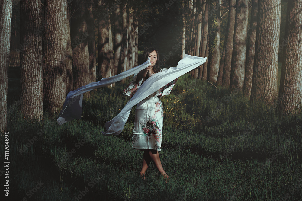 Beautiful woman dancing in ethereal forest - obrazy, fototapety, plakaty 