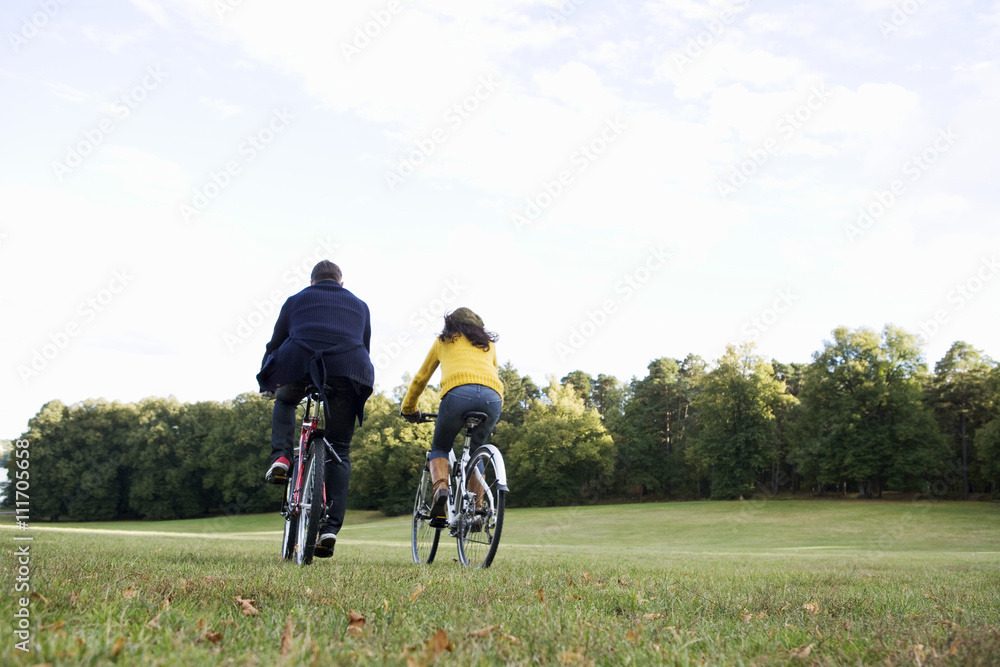 A woman and a man riding a bike an autumn day, Sweden. A woman and a man riding a bike an autumn day, Sweden.