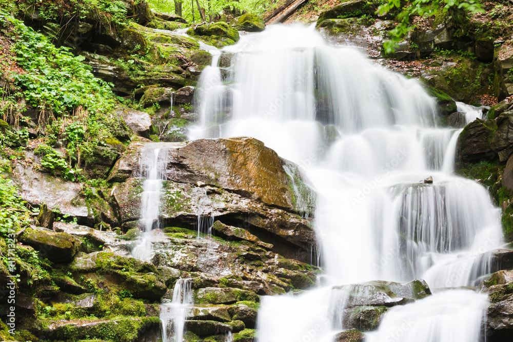 small waterfall of mountain river small waterfall of mountain river