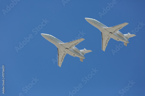 Two private jets flying close to each other