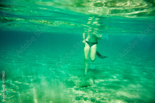 Underwater scene in Ionian sea, Zakynthos, Greece, with girls playing in the water