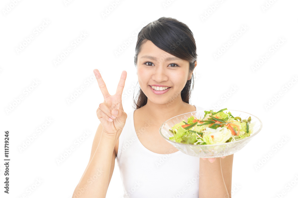 サラダを食べる女性 サラダを食べる女性