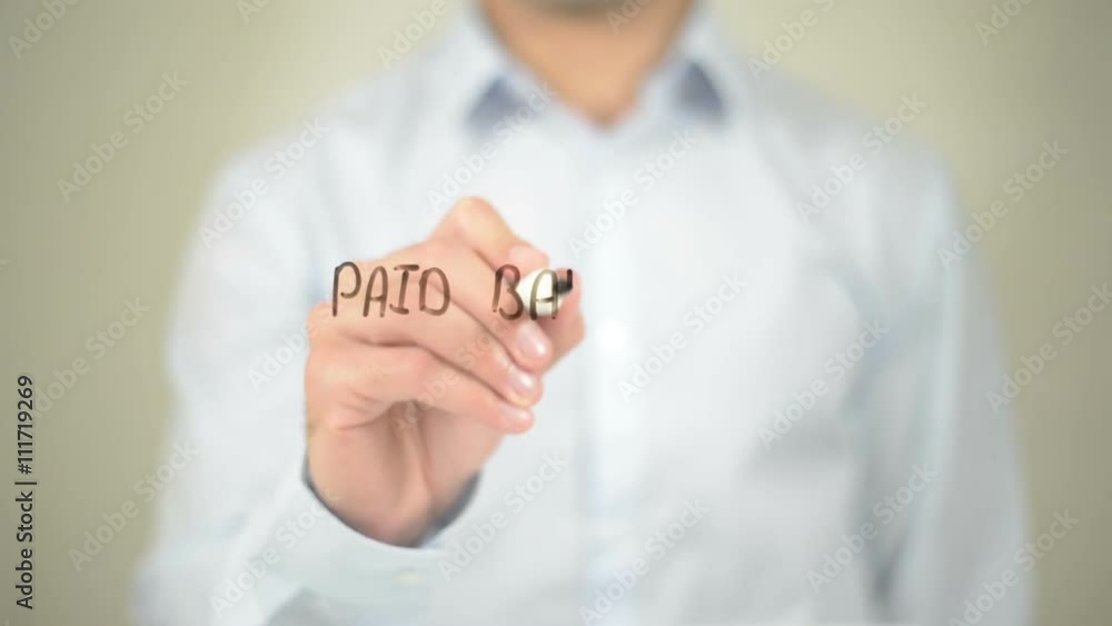 Paid Balance , Man writing on transparent screen Paid Balance , Man writing on transparent screen