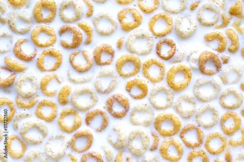 Wheat, rice and corn rings in milk for breakfast 