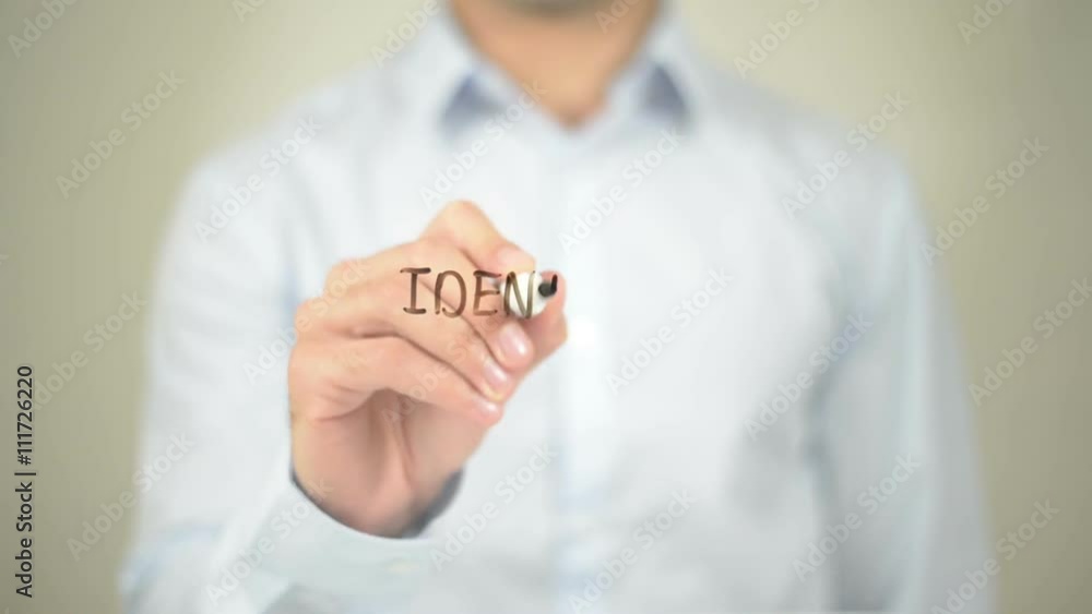 Identity , Man writing on transparent screen Identity , Man writing on transparent screen