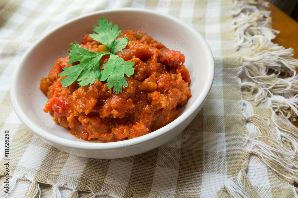 Thai Northern local Style minced Pork and Tomato Relish paste dip. Nam Prik Ong.
very famous spicy yummy hot chilli pepper paste sauce.
Thai Northern local Style minced Pork and Tomato Relish paste dip. Nam Prik Ong.
very famous spicy yummy hot chilli pepper paste sauce.