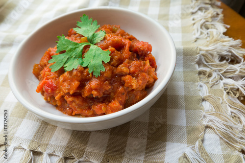 Thai Northern local Style minced Pork and Tomato Relish paste dip. Nam Prik Ong. 
very famous spicy yummy hot chilli pepper paste sauce.
 