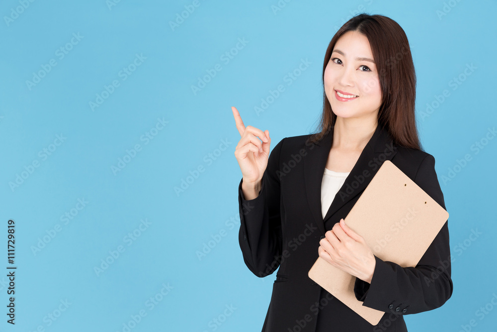 portrait of asian businesswoman showing isolated on blue background portrait of asian businesswoman showing isolated on blue background