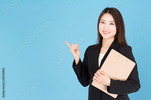 portrait of asian businesswoman showing isolated on blue background