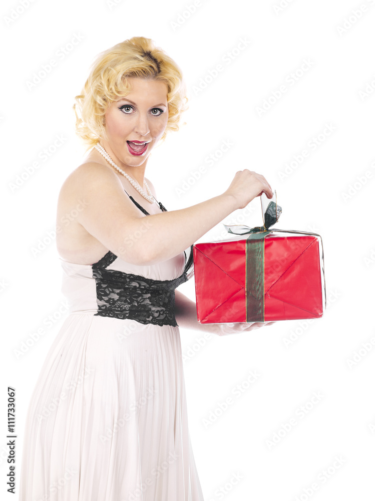 beautiful young woman opening her christmas present. beautiful young woman opening her christmas present.