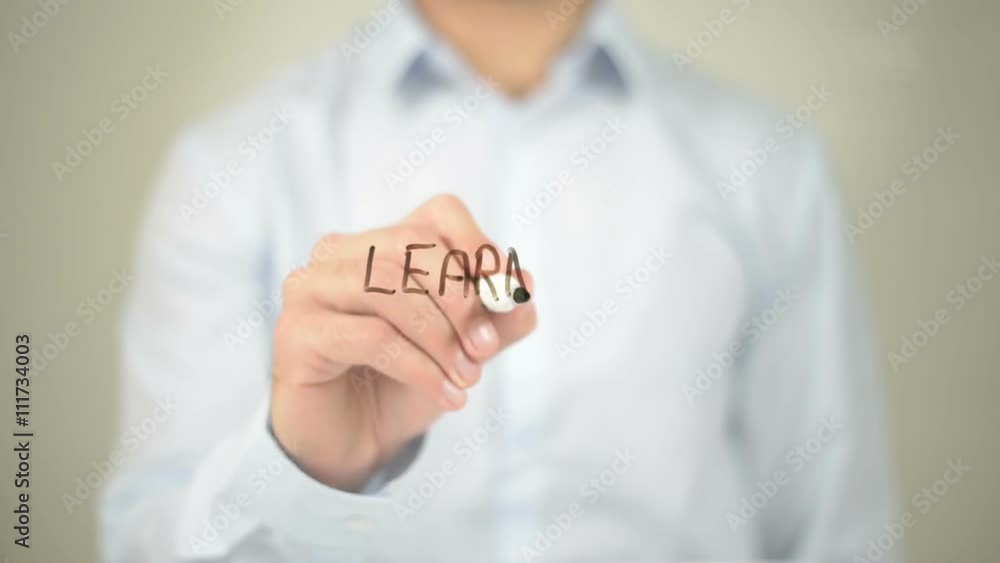 Learning , Man writing on transparent screen Learning , Man writing on transparent screen