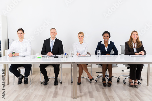 Tableau sur toile Businesspeople Sitting At Conference