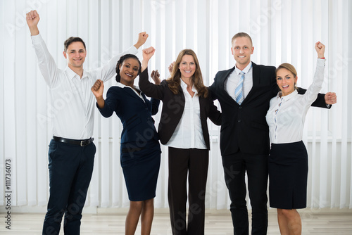 Successful Businesspeople Raising Hands