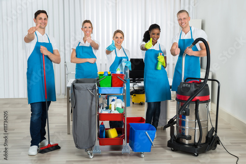 Cleaners With Cleaning Equipments In Office