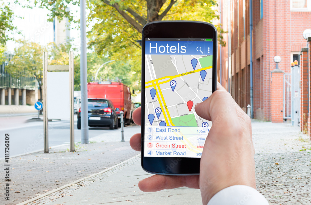 Person Using GPS Navigation On Phone Hotels Stock Photo | Adobe Stock