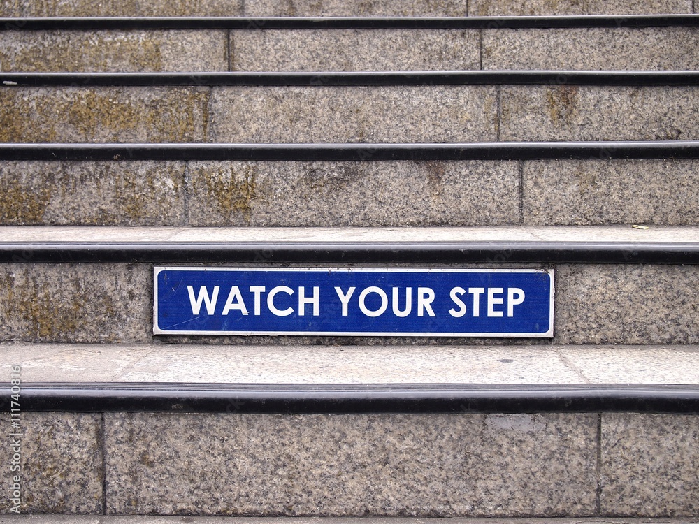 Obraz premium Watch your step sign on a staircase