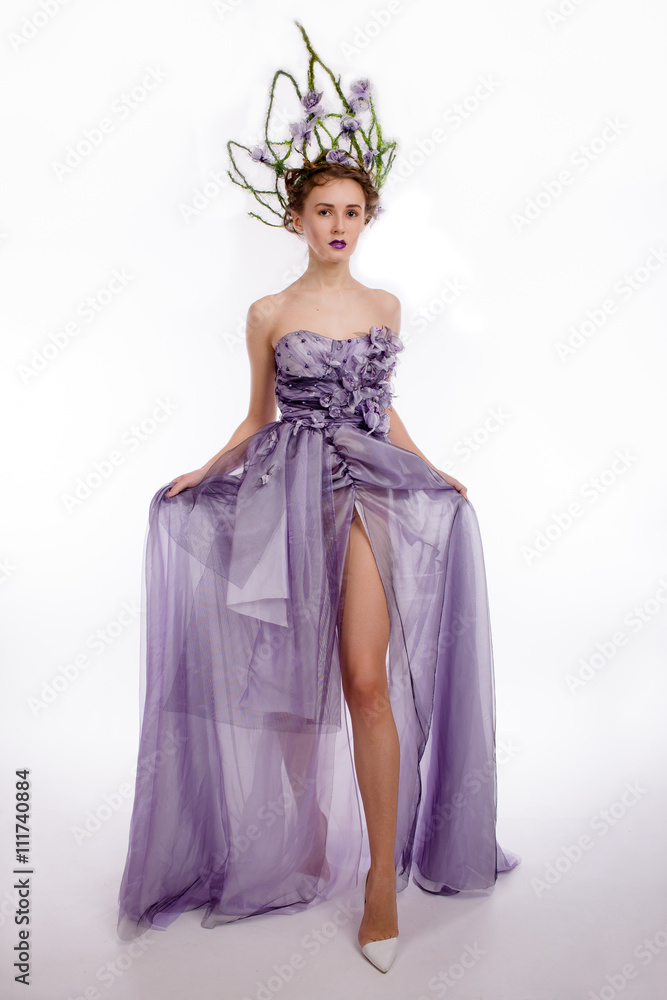 Studio shot beautiful crowned model in dress Studio shot beautiful crowned model in dress