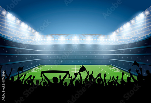 Excited crowd of people at a soccer stadium. Football stadium.
