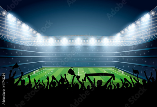 Excited crowd of people at a soccer stadium. Football stadium.
