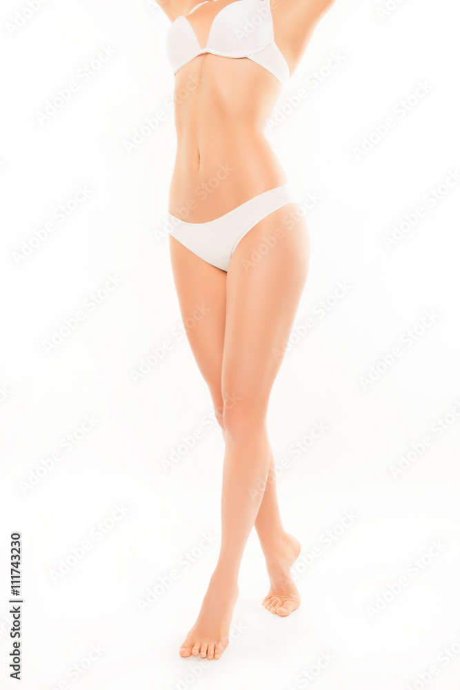 Close up photo of slim woman's body and long smooth legs