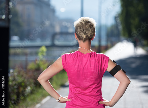 jogging woman setting phone before jogging © .shock