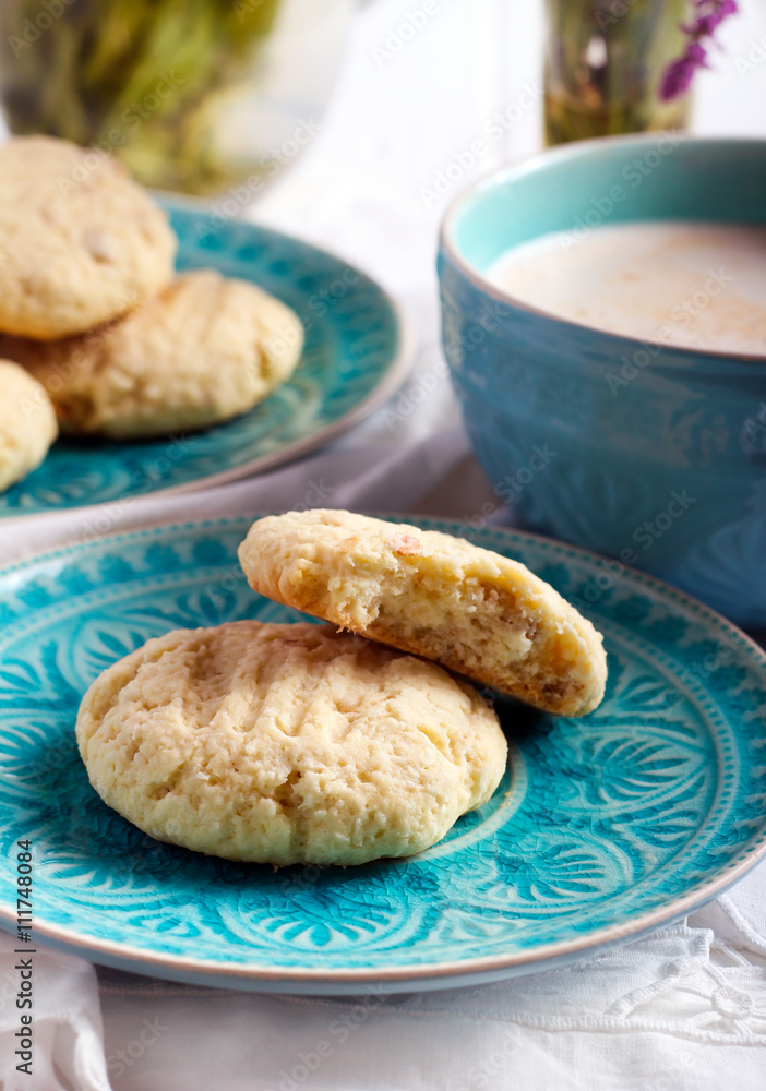 Coconut crunchy cookies on blue plate Coconut crunchy cookies on blue plate