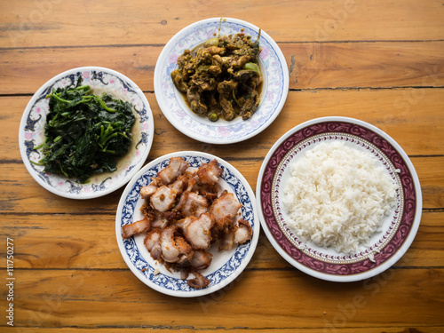 Thai food meal , crispt pork , fried vegetable , rice , spicy ch