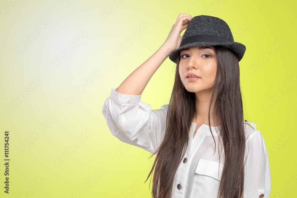 Beautiful young woman wearing summer fedora straw hat posing Beautiful young woman wearing summer fedora straw hat posing
