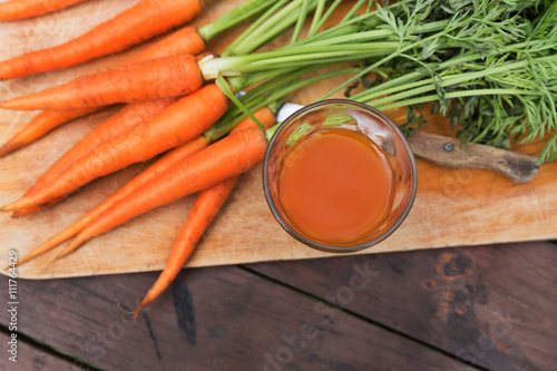Fresh carrot juice crop in garden