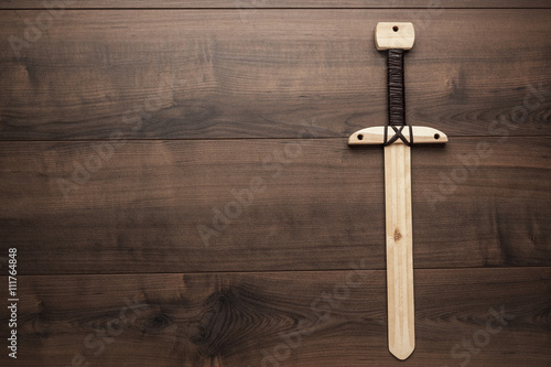 handmade wooden training toy sword on the table