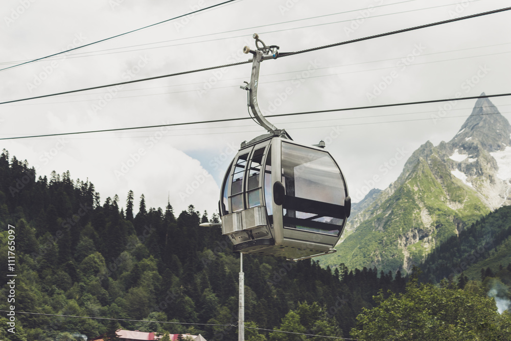 Fototapeta premium cableway cabin in the mountains. alpine landscape