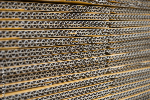 stack of corrugated cardboard boxes. egde view of flattened boxe