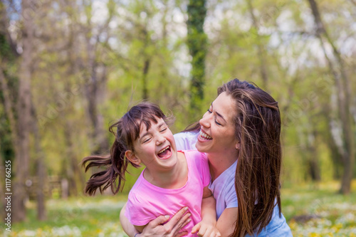 Mother with daughter in park 