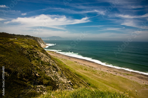 travel to picturesque azkorri beach in springtime, basque country, spain photo