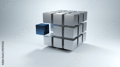 3D cube with sections in gray and one in blue photo