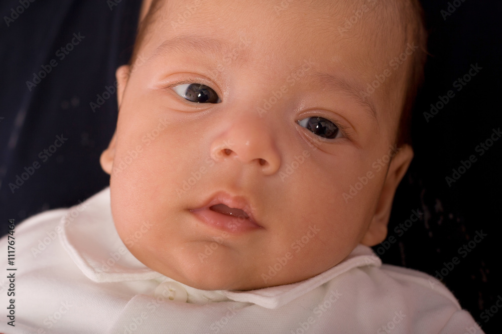 Baby kid on the dark backing closeup portrait Baby kid on the dark backing closeup portrait