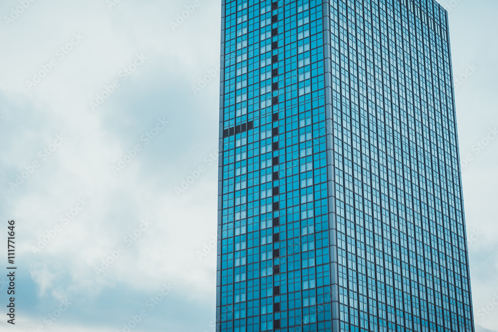 Office building on sky background.