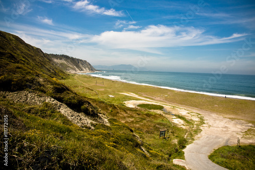 picturesque azkorri sandy beach by the atlantic cornice, basque country, spain photo